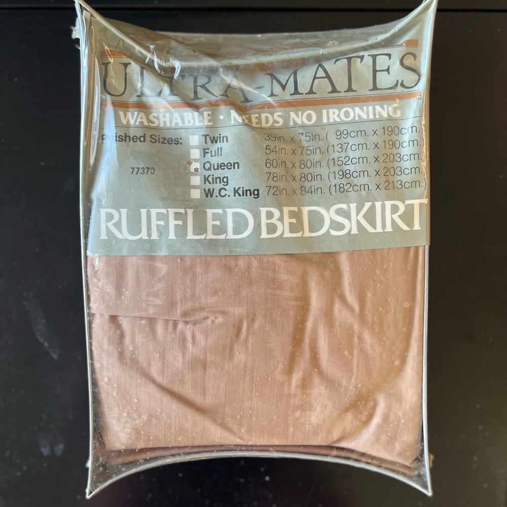 Never opened queen ruffled bed skirt.